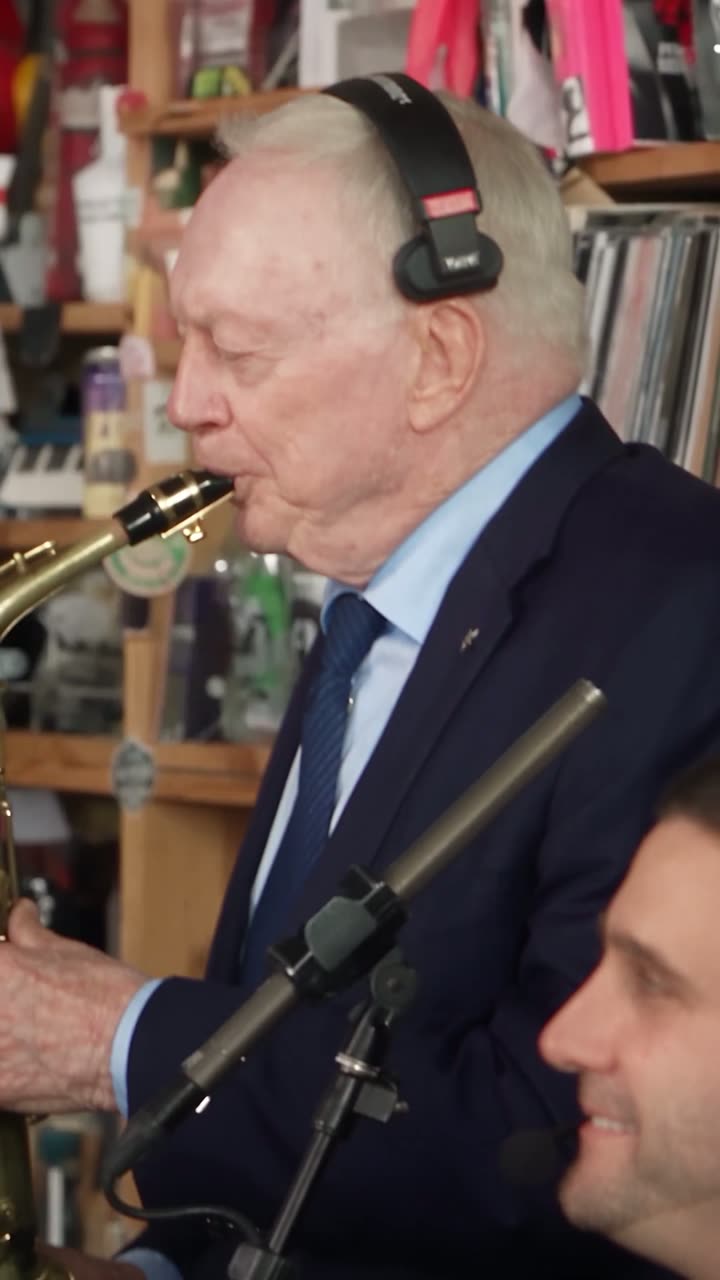 Saxophone solo at a desk concert, from a viral Tiny Desk AI video
